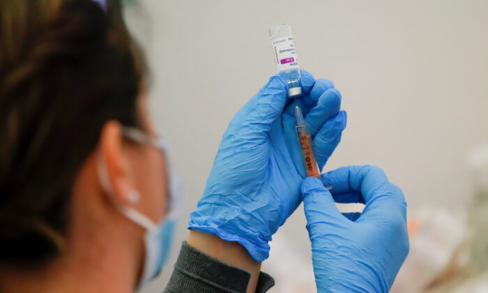 A dose of the AstraZeneca COVID-19 vaccine is prepared in a vaccination centre at Newmarket Racecourse, amid the coronavirus disease outbreak in Newmarket, Britain, on March 26, 2021. (Andrew Couldridge/Reuters)