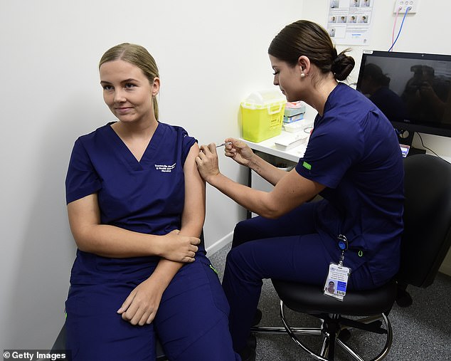 One of the major risk factors for blood clots is diabetes. Pictured: A Townsville nurse in Queensland gets the vaccine last month